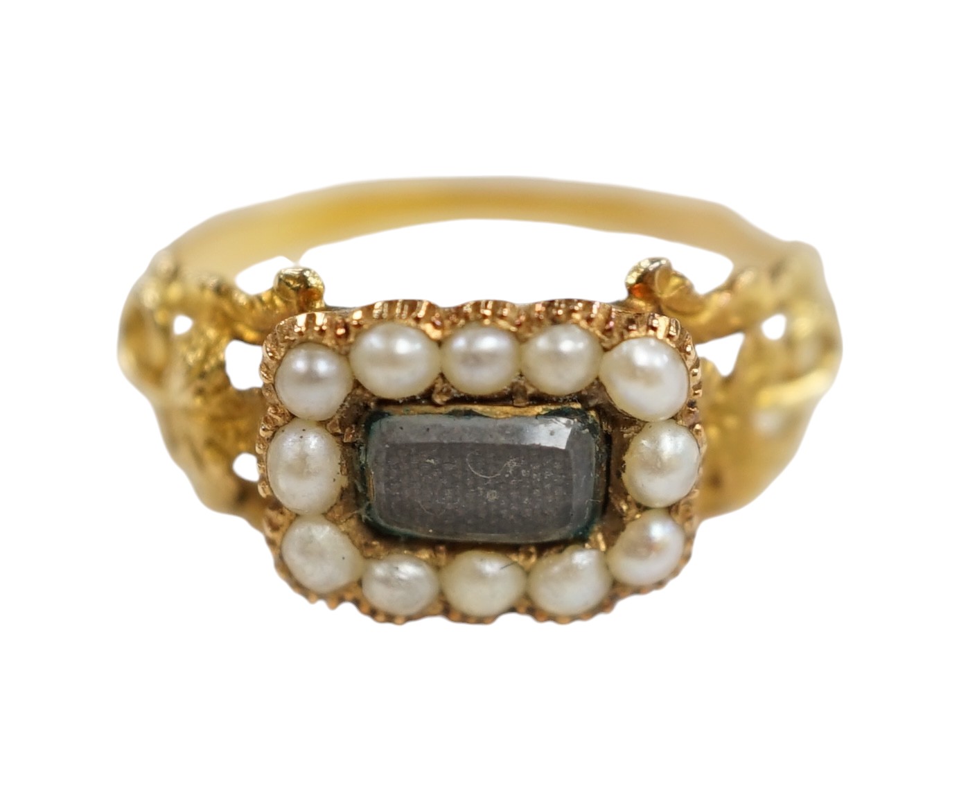 A 19th century yellow metal, seed pearl and plaited hair set mourning ring, the ring head verso inscribed 'In memory of a dear sister', size J, gross weight 1.4 grams. Condition - fair